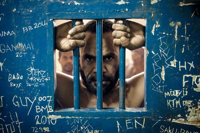Andres, 39, accused of multiple rapes, waits for his court date in a cell in the Boroko Police Station.
