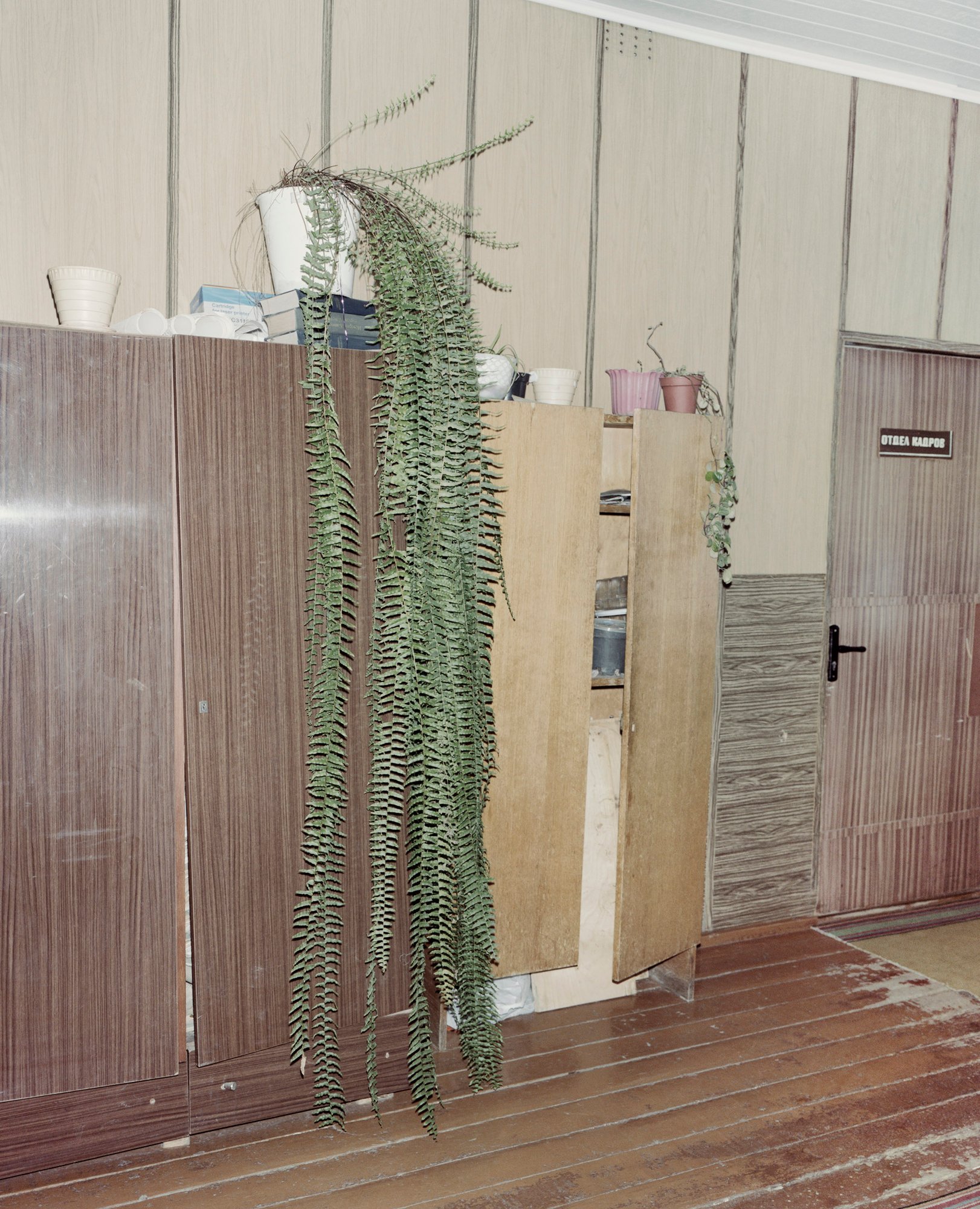 Belarus / Kryvancy / 21.02.2013 / Kolkhoz administration room where Valeri, the best plowman, refused to be photographed. From the series "The Winners," 2010–2013 © Rafał Milach