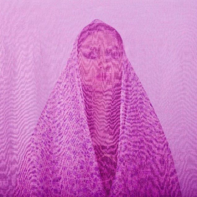 Yalda, an Iranian woman is photographed through the fabric of her hijab (the Islamic headscarf worn by women in the presence adult men who are not members of her immediate family). Since the Islamic revolution in 1979, Iranian women are not allowed to be seen in public without proper Islamic head dress in Iran. Not wearing a proper hijab is illegal and can result in arrest by a special police unit