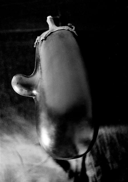 This eggplant floating into the room, emits light form its skin.