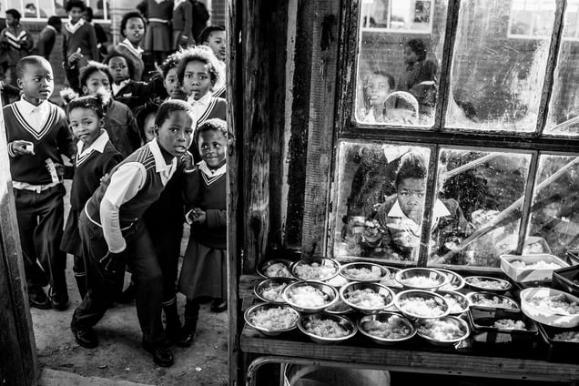 Kids at Bell Primary School peering into the kitchen.
