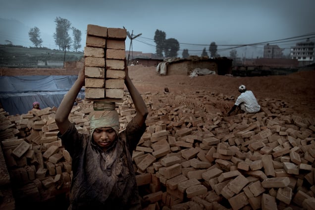 Worker transporting a load