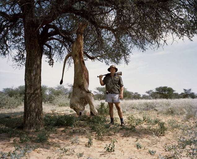 untitled professional hunter with trophy lion.kalahari, northern cape, south africa-from the series 'hunters'-David Chancellor