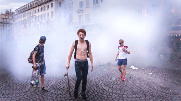 Marseille, France (2016). England supporters emerge from teargas during clashes with rival Russian fans and French police at the Vieux Port in Marseille.