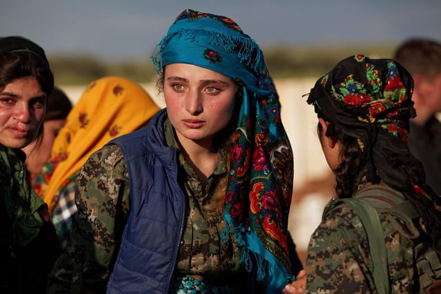 At a cemetery in Kobane, Syria, on 14 April, 2015, few members of YPJ (Women's Protection Units), mourn during the ceremony for Ageri, thier fellow fighter who was killed during clashes with Islamic State in Eastern frontline of Kobane, Syria.