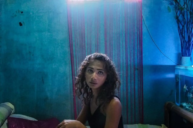 Angel posing in her room