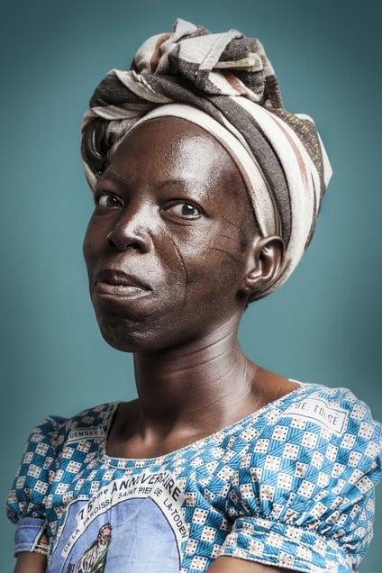 Ms. Martine : “When I was 10 years, I asked for them. I wanted to be like my brothers and sisters, and to show that I am courageous. " © Joana Choumali