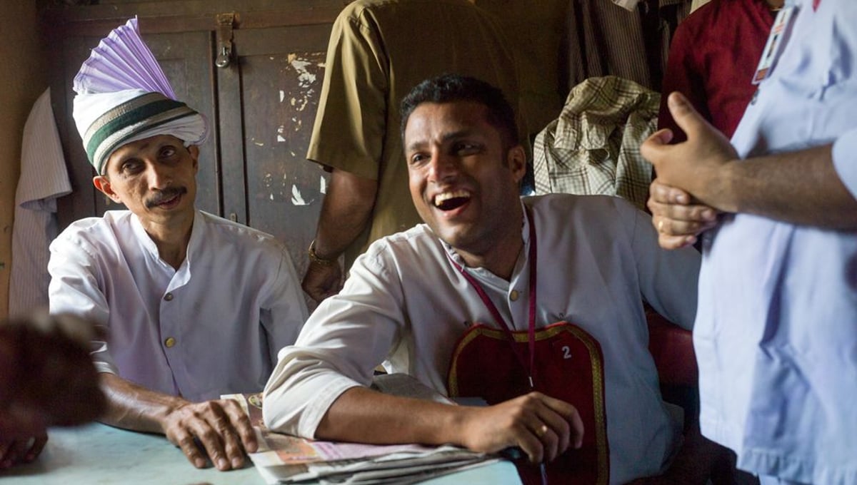 Waiters laugh and joke during a break in the staffroom of the Indian Coffee House, Kottayam, Kerala, India ©Stuart Freedman