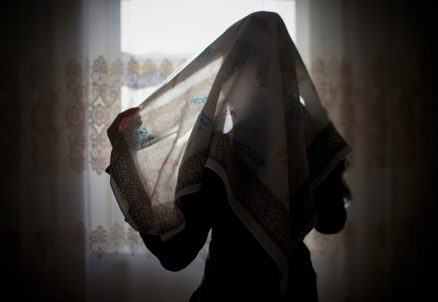 Seda Makhagieva, 15, wraps a pastel-colored head and neck covering. Makhagieva fought to wear the hijab - a sharp break from her families' traditions.