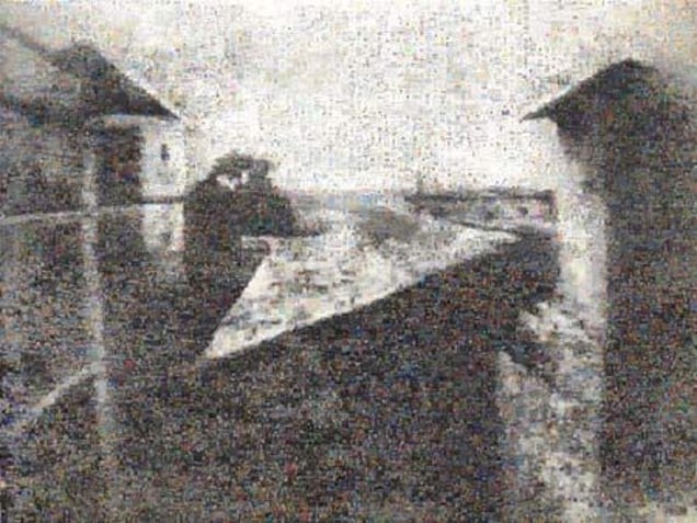 Niepce, 2005, First photograph in history, taken by Nocéphore Niepce in Gras, France, 1826. The photograph has been refashioned using photomosaic freeware, linked to Google Image Search function.  The final result is a composite of 10,000 images available on the Internet that responded to the words photo and foto as search criteria.