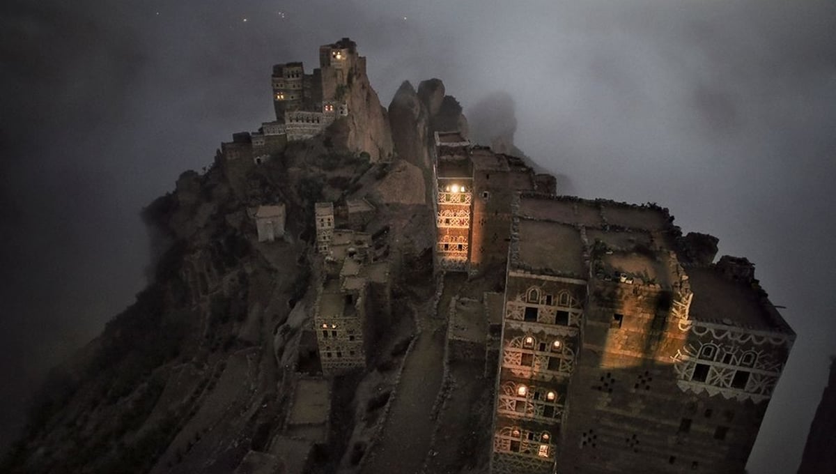 Shugruf, Yemen: The morning mist rises mystically from the valley towards the small town in the Haraz mountains. © Matjaz Krivic