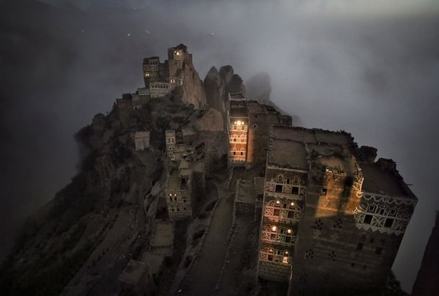 Shugruf, Yemen: The morning mist rises mystically from the valley towards the small town in the Haraz mountains. © Matjaz Krivic