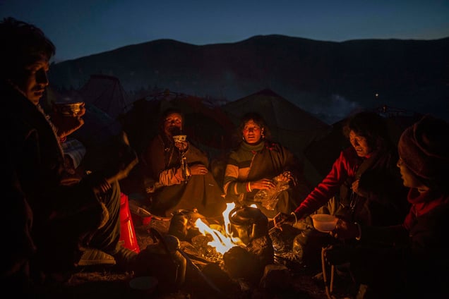 Tibetan Buddhist nomads cook by candlelight in Sertar county, Garze Tibetan Autonomous Prefecture, Sichuan province, China, 31 October 2015.