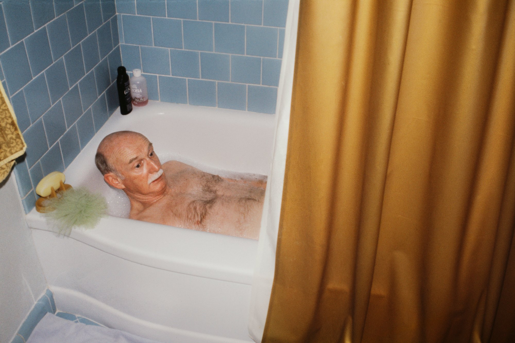 "Dad in the Tub" from the book "Too Many Products Too Much Pressure" © Janet Delaney