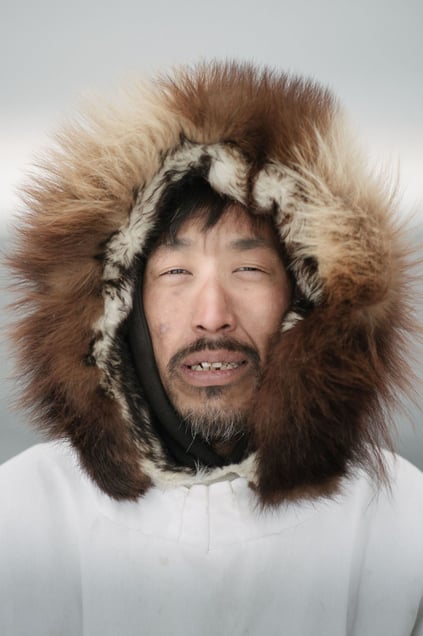 Sigvaun Kaleak and his father Raleigh wear traditional ice camouflage parkas. They are lifelong whalers. Although European whaling decimated the global whale population by the 1900, the Iñupiat maintained a sustainable harvest of bowheads.