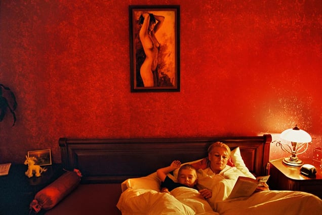 An entrepreneur reads a book to her 10-year-old son at bedtime. Pezinok, 2004. © Andrej Balco