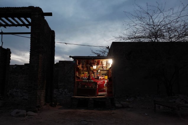 Previously a salt miner, this man now too old, sells snacks and cigarettes from his small shop in the grounds of the salt mine at Warcha.