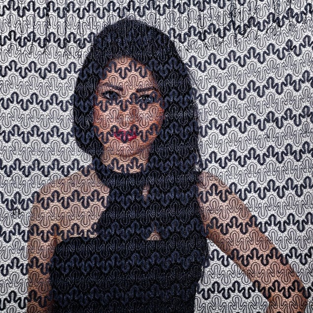 Samaneh, an Iranian woman is photographed through the fabric of her hijab (the Islamic headscarf worn by women in the presence adult men who are not members of her immediate family). Since the Islamic revolution in 1979, Iranian women are not allowed to be seen in public without proper Islamic head dress in Iran. Not wearing a proper hijab is illegal and can result in arrest by a special police un