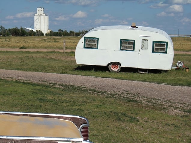 RV trailer outside the museum,and grain elevator in the distance, Genoa, CO.