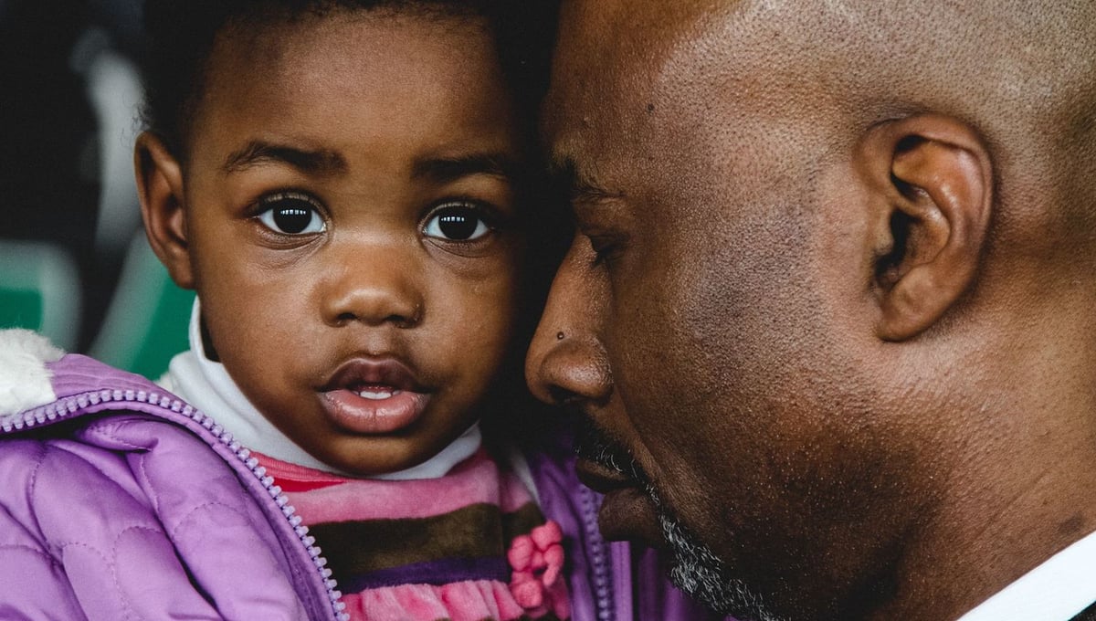 Rodney and his daughter, Miracle, at a Sunday worship service at Citadel of Faith Covenant Church. Detroit, MI. 2010 © Jeremy Brockman