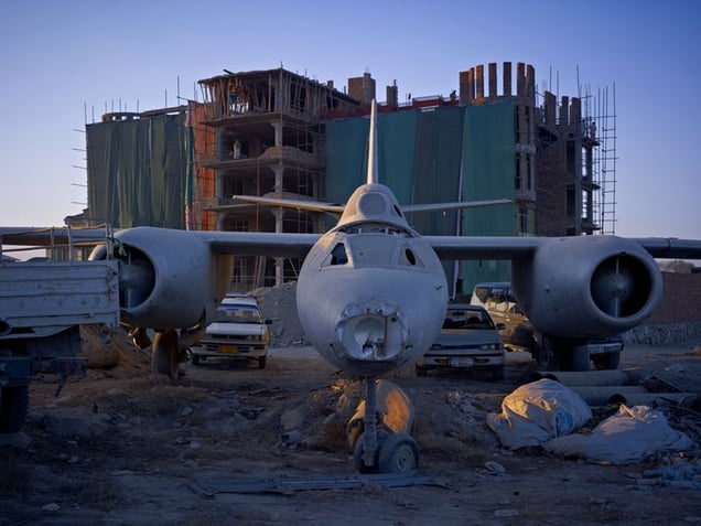 A dumping ground for an abandoned Russian-era bomber that has now been incorporated into the car park of Shamshad TV, a new media company supported heavily by American money.
© Simon Norfolk.