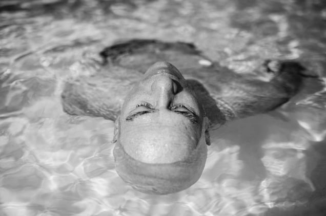 Weak from chemotherapy, Howie Borowick floats effortlessly and slowly around the pool during a midweek getaway to a warm climate. Naples, Florida. January, 2013 © Nancy Borowick
