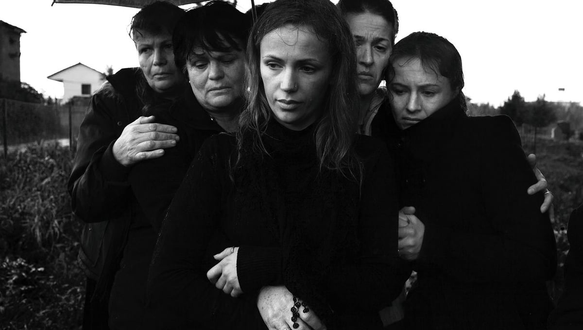According to Albanian tradition, men and women attending funerals in separate groups. Tirana, Albania © Enri Canaj