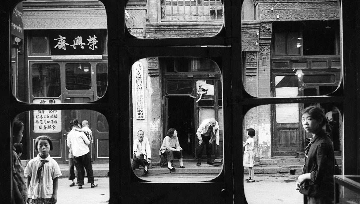 These windows overlook Liulichang, the street of antique and curio shops. Here, during the Cultural Revolution, people were expected to hand over their jewelry to the state, receiving nothing in exchange. China, 1965