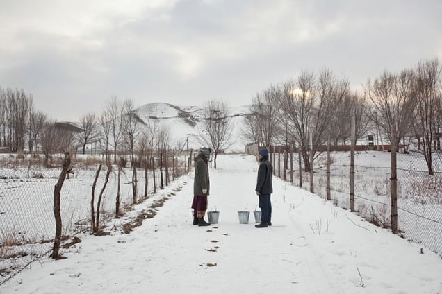 Two pilgrims taking a break while bringing water from the river.
From the series Apashka by © Pavel Prokopchik