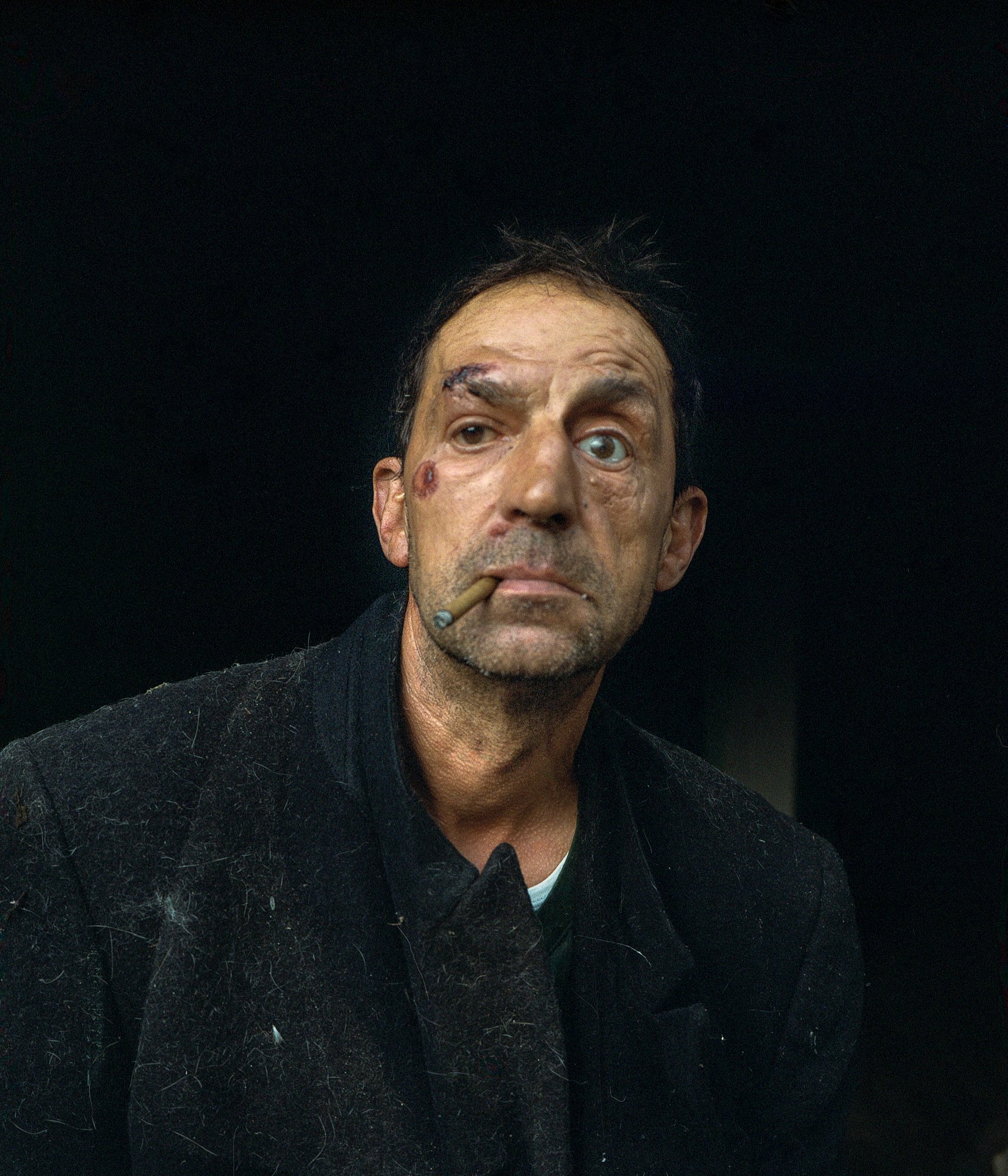 Tony. Tony used to arrive home with nuts, claiming that his girlfriend, Rosemary, had given them to him. However, Rosemary only existed in his mind. Tony resides in Atas, a small remote village on the border between Galicia and Portugal. He grew up with alcoholic parents and, unfortunately, became an alcoholic himself. Tony says, "I remember that when I was a child my father would put a glass of wine on the table for me and tell me 'Drink! A little bit won't hurt you". When Tony drinks alcohol he quickly loses control over himself to the point of losing an eye due to a car accident while driving drunk. He currently lost his job due to his alcoholism and lives on state aid and his family's charity. The depression in the area, the lack of job opportunities, and the communication difficulties made it even more challenging for him to overcome his alcoholism. © Carlos Folgoso Sueiro