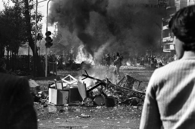 As the revolution intensified, demonstrations grew bigger and more frequent throughout the streets of Iran. This led to violent clashes between the Shahs armed forces and the anti-Shah demonstrators, as seen here on Esteqlal street in Tehran, IRAN  1979
© Copyright 1979-2009 Alfred Yaghobzadeh. All rights reserved.
