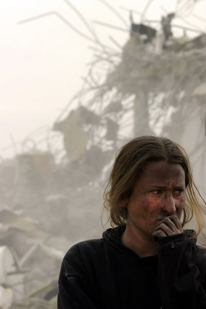 Young Jewish settler next to ruined houses after evacuation of Amona © Natan Dvir