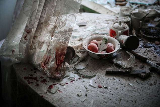 Kitchen table after mortar attack, Donetsk, Ukraine, 26 August. General News Singles, 1st place. Sergei Ilnitsky, Russia, European Pressphoto Agency