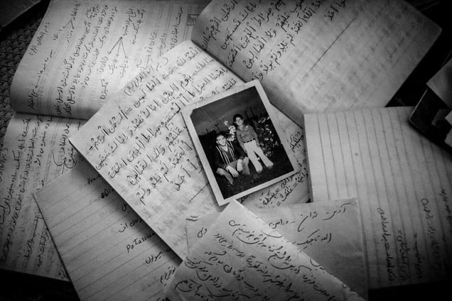 All mothers have kept Clothing and Letters of the her sons that These help mothers not forgeting their sons _ Notes and photos belonging to Mohammad Tajik, who was killed in the war when he was 18 years .Robabeh ali kahi 67 is waiting for 31 years _ IRAN _ varamin