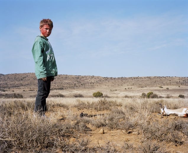 bloodied hunter # IV with buck, south africa-from the series 'hunters'-David Chancellor