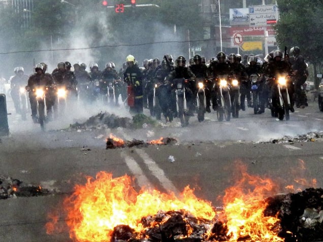 Iranian Basij members sit on motorcycles as they face protesters during a demonstration in Tehran. Thousands of Iranians clashed with police as they defied an ultimatum from supreme leader Ayatollah Ali Khamenei for an end to protests over last weeks disputed presidential election. Tehran, IRAN - June 20, 2009
© Copyright 1979-2009 Alfred Yaghobzadeh. All rights reserved.