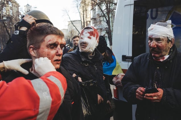 Doctors provide medical assistance to those victims who suffered during a crackdown on Institutska street. Kiev, Feb. 18, 2014