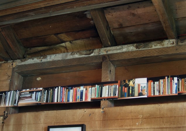 Right wall view: detail- 'Ex Libris: Self-Portrait as a Long Bookshelf,' altogether seventy-seven color photographic prints.