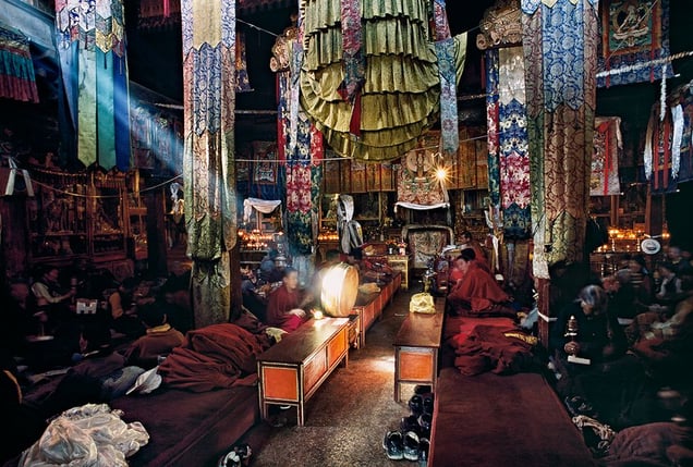 Lhasa, Tibet: Monks worshipping the deities during the July full moon in the monastery pray night and day with no pauses. © Matjaz Krivic