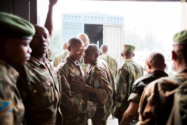 The lower-ranked accused FARDC soldiers pile into the truck that will transport them back to custody at the end of a trial day. The 12 higher-ranked officers on trial left on their own accord.  They were not in custody and able to move freely.© Diana Zeyneb Alhindawi