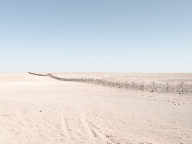 Graziani’s Fence (270 kilometer barbed-wire fence), near Jaghbub, Libya | © Matthew Arnold Photography