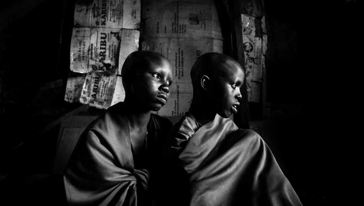 Maasai-girls Isina & Nasirian are sitting in their father's hut a day before the planned circumcision. © Meeri Koutaniemi