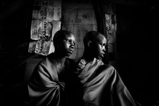 Maasai-girls Isina & Nasirian are sitting in their father's hut a day before the planned circumcision. © Meeri Koutaniemi