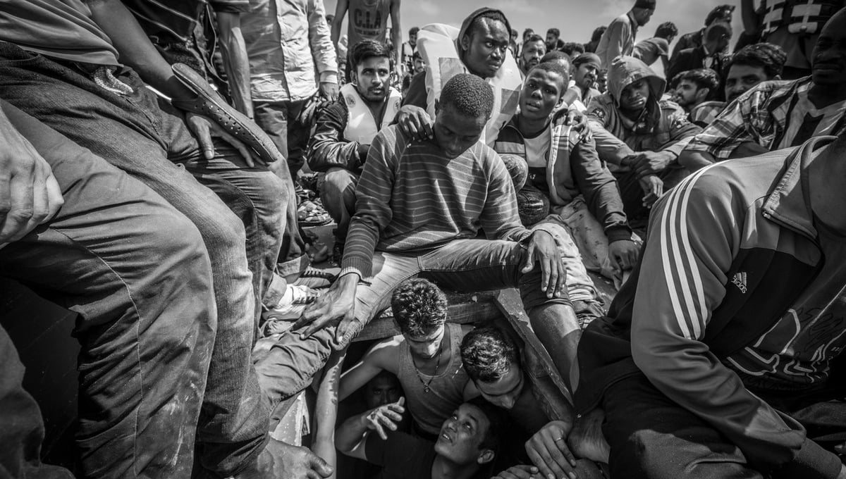 Bengladeshi migrants begged to be released from the hold of a boat carrying 414 men, women and children where they had been for over 14 hours