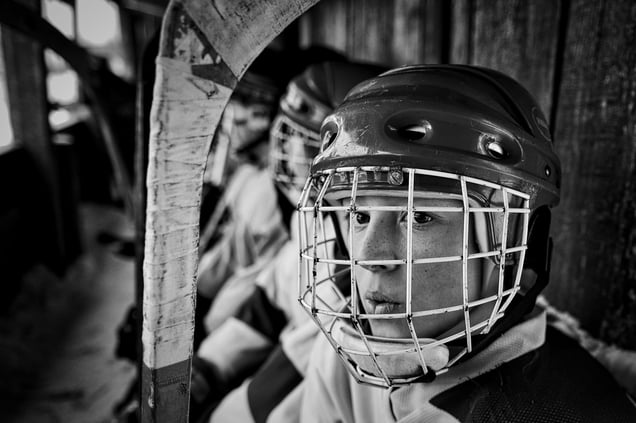 A player from the junior team from the village Sharanga is expected to yield to the ice in Vetluga, Russia, 19 February 2015.