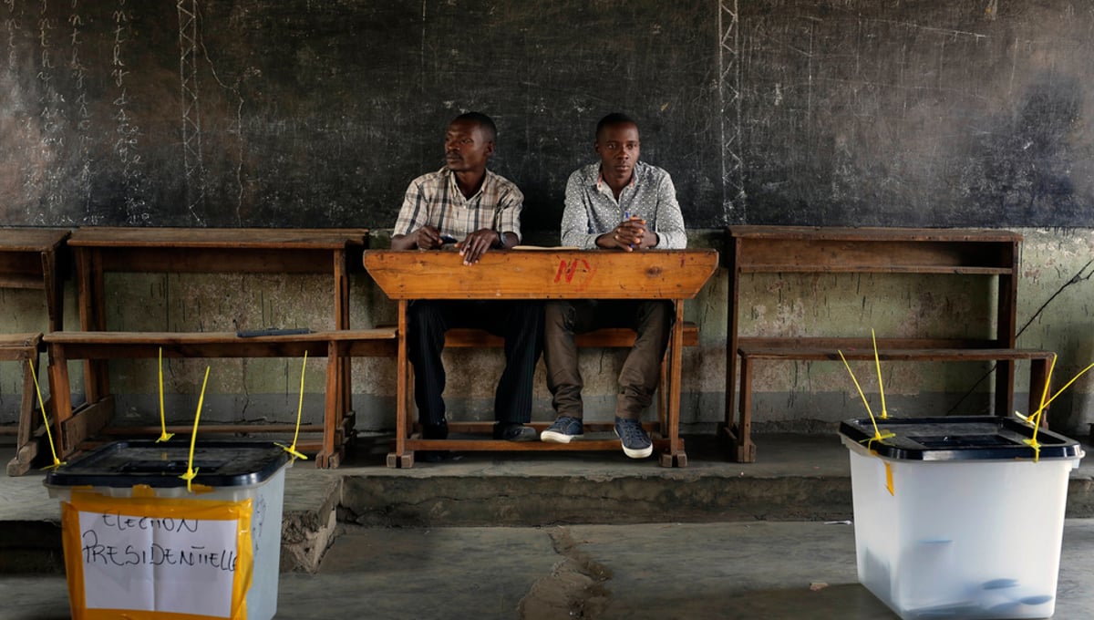 Election observers sit in an empty  polling station for the presidential elections in  Bujumbura, Burundi, Tuesday July 21, 2015. Photo by Jerome Delay