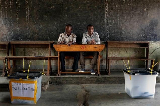 Election observers sit in an empty  polling station for the presidential elections in  Bujumbura, Burundi, Tuesday July 21, 2015. Photo by Jerome Delay