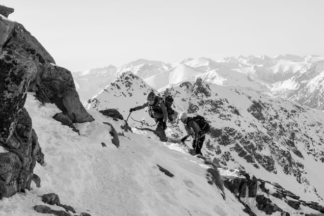 A couple of tourists climbs high peaks of the Tatra mountains.