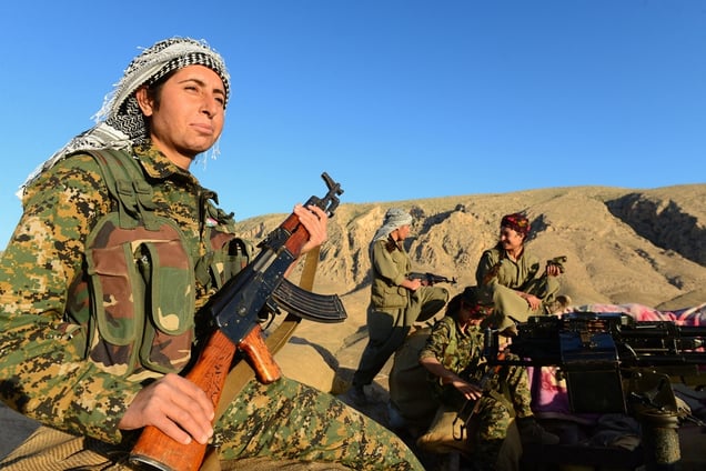 Two kilometers from the ISIS frontline, five fighters with the Kurdish Women’s Defense Units, including two young Yazidis, hold the strategic position above the village of Bare, cutting off access for ISIS troops trying to reach Syria, less than six kilometers away. Sinjar mountains, Iraq, May 13, 2015. © Alfred Yaghobzadeh for Paris Match