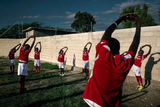 Five years on from the earthquake, sports are one of the areas in which Haiti is beginning to recover. In every neighbourhood there are impromptu football and basketball matches to be seen. A football match at "L’academia de futebol pero las negras."